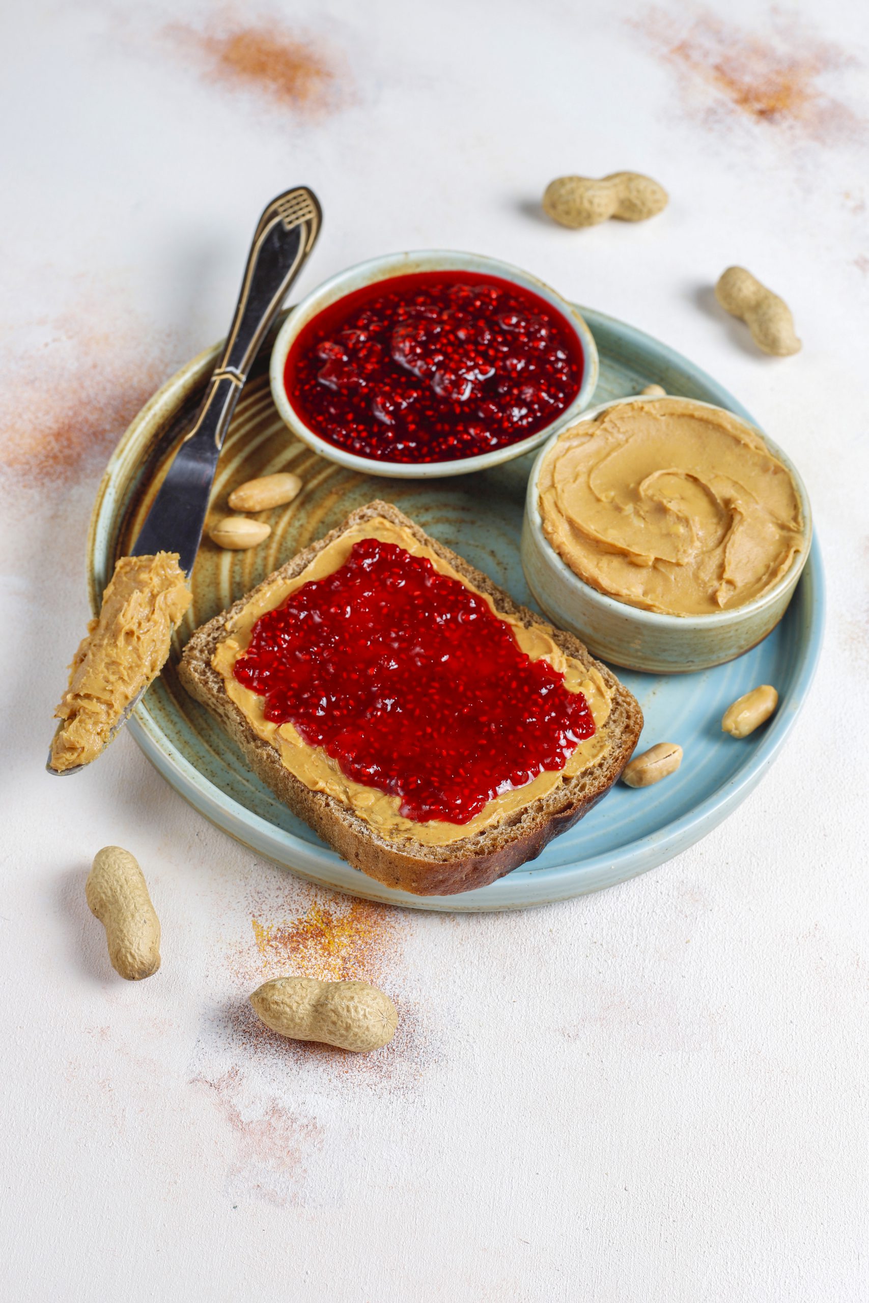 Peanut butter sandwiches or toasts with raspberry jam.